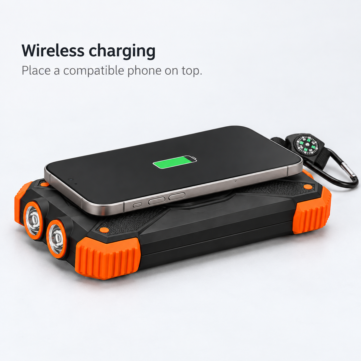 Low side-angle view of a phone resting on the wireless charging surface of the power bank.