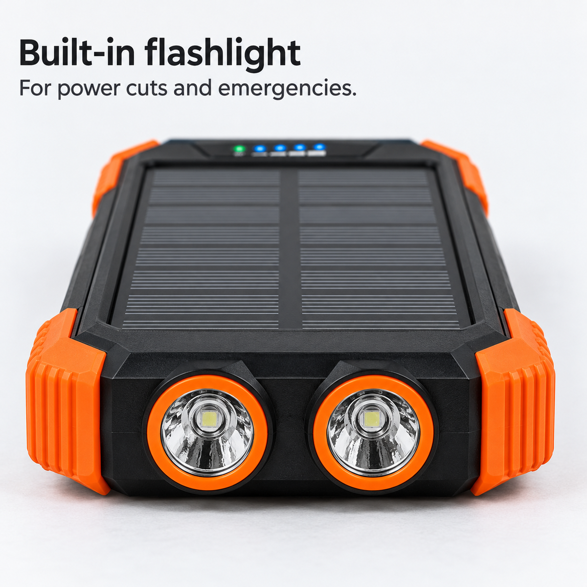 Head-on close-up of the two flashlight lenses at the short end of the power bank.